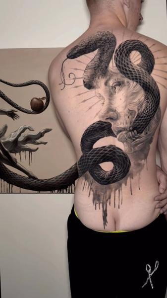 Realism snake and face tattoo by @jakconnollyart