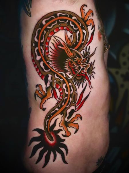 Traditional traditional dragon tattoo by @straats_tatts