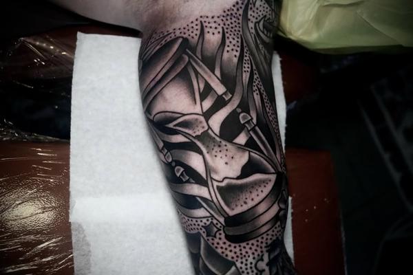 Blackwork hourglass ribbons tattoo by @straats_tatts