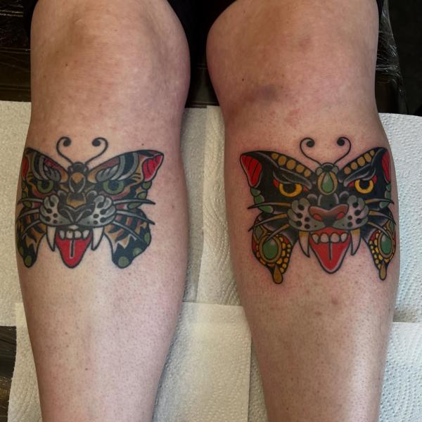 Traditional butterfly panther tattoo by @jamiegreavestattooer