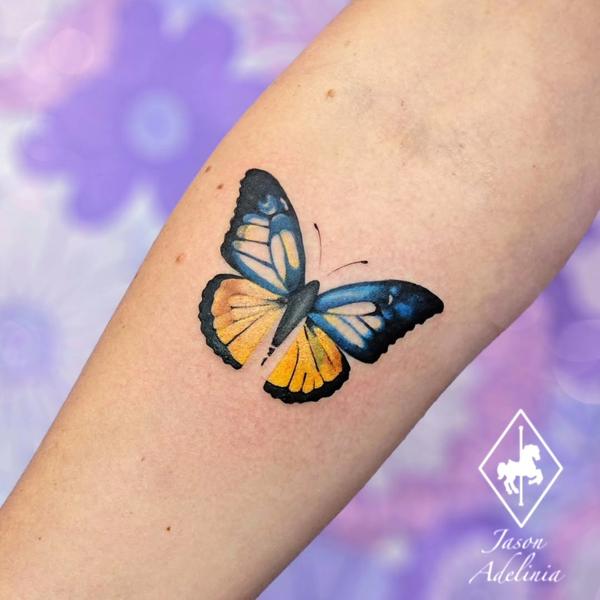 Realism colorful butterfly tattoo by @jason_adelinia