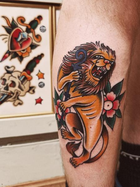Traditional traditional lion tattoo by @flashntatz