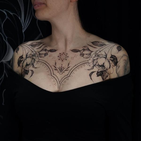 Ornamental floral chest piece tattoo by @jessicadaveridgetattoo