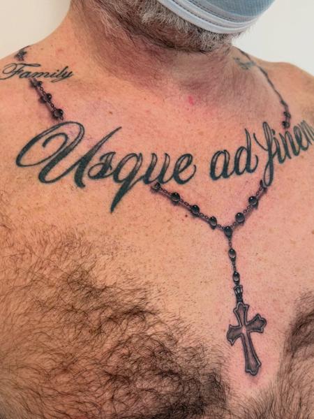 Blackwork rosary cross tattoo by @jess_dias_tattoos