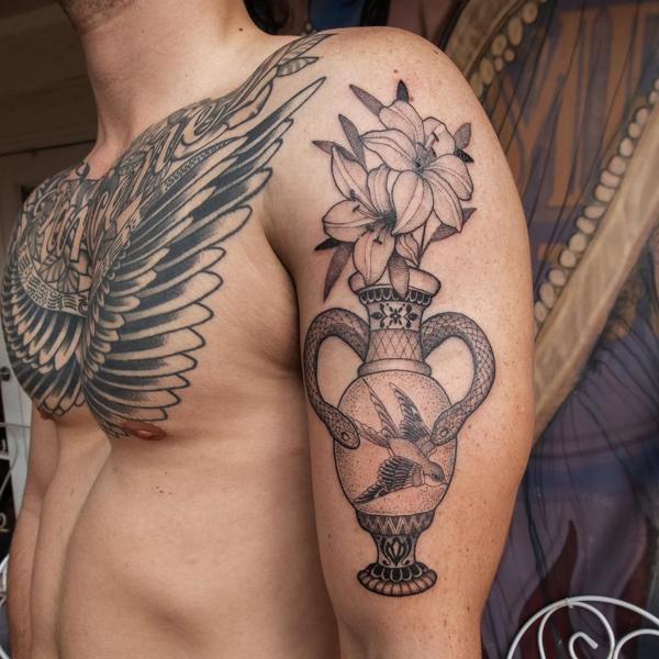Illustrative floral vase snake tattoo by @jimi.james.tattoos