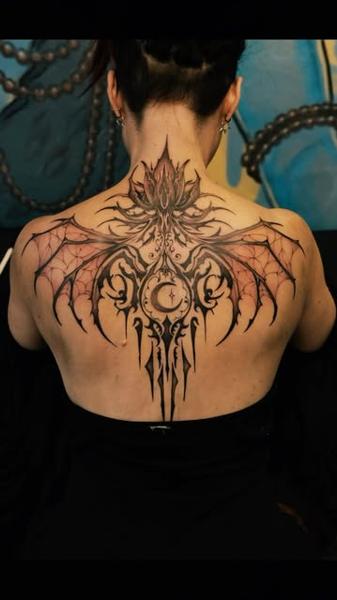 Gothic blackwork gothic bat wings tattoo by @jimi.james.tattoos