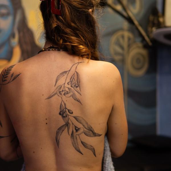 Illustrative eucalyptus branches tattoo by @jimi.james.tattoos