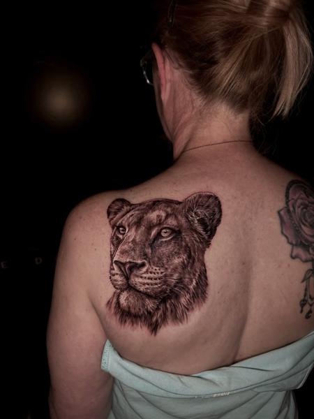 Realism lion portrait tattoo by @jim.tat