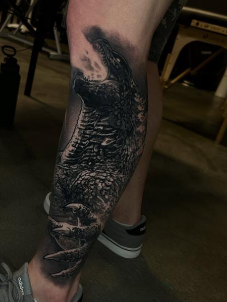 Realism roaring dinosaur tattoo by @joe_cider