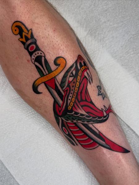 Traditional dagger snake tattoo by @joegarey_tattoo