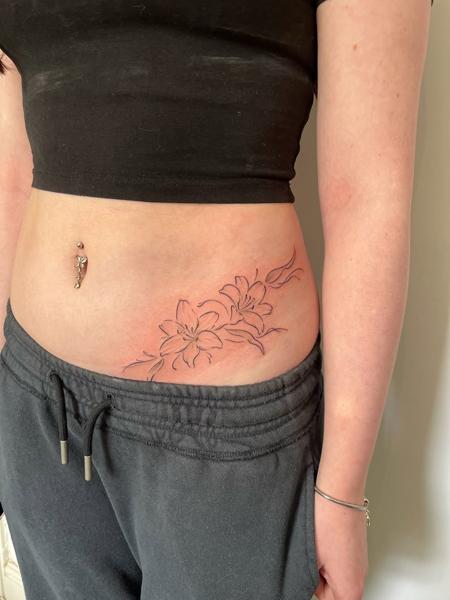 Fine line floral design tattoo by @joelclementstattoo