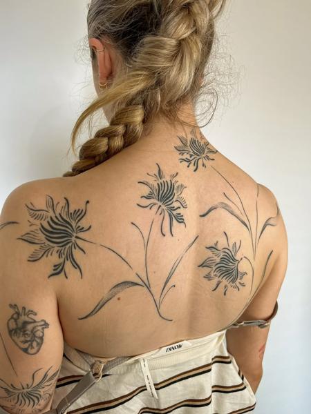 Fine line floral design tattoo by @joelclementstattoo