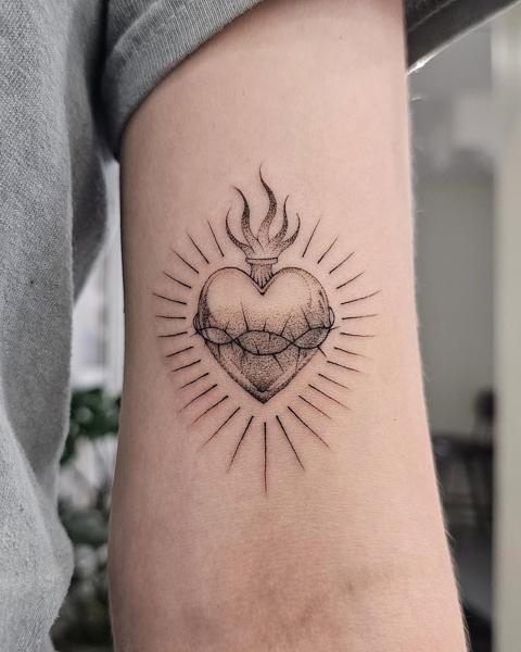 Fine line sacred heart tattoo by @paradox_tattoos