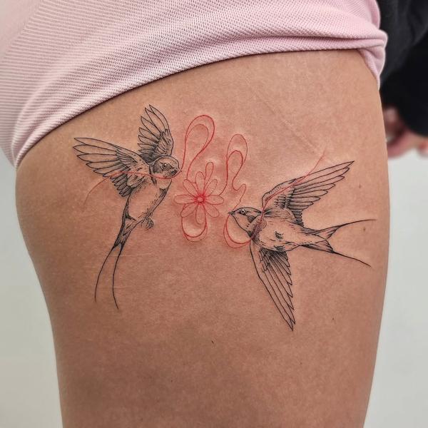Fine line swallows and flower tattoo by @paradox_tattoos