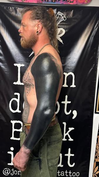 Blackwork blackout sleeve tattoo by @jonnyransomtattoo