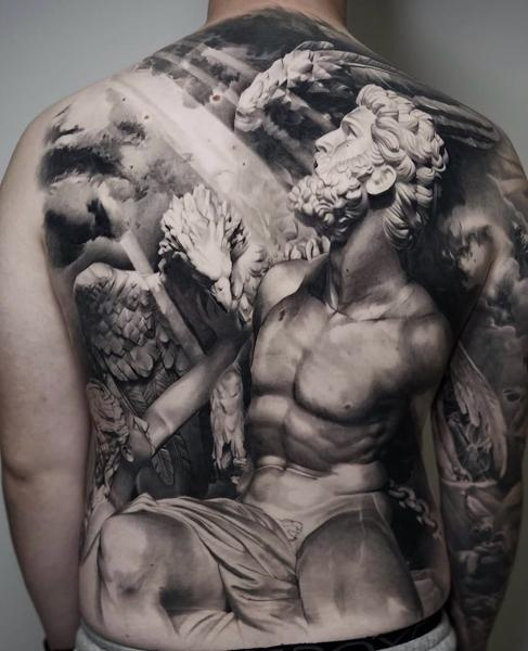 Realism angelic statue tattoo by @jordanferristattoo