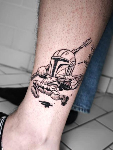 Fine line cartoon mandalorian tattoo by @joseffadel