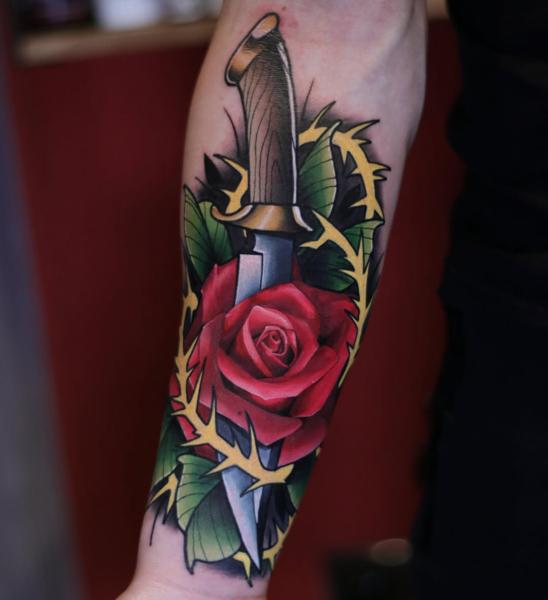 Traditional dagger rose tattoo by @joshwaatattoo