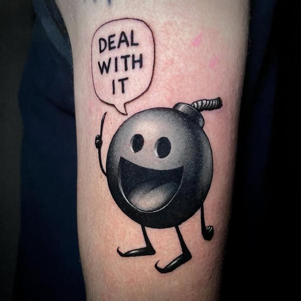 Illustrative smiling bomb tattoo by @joshpeacock_obe1
