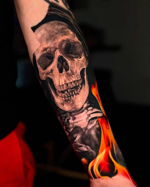 Realism flaming skull tattoo by @jtatattoos