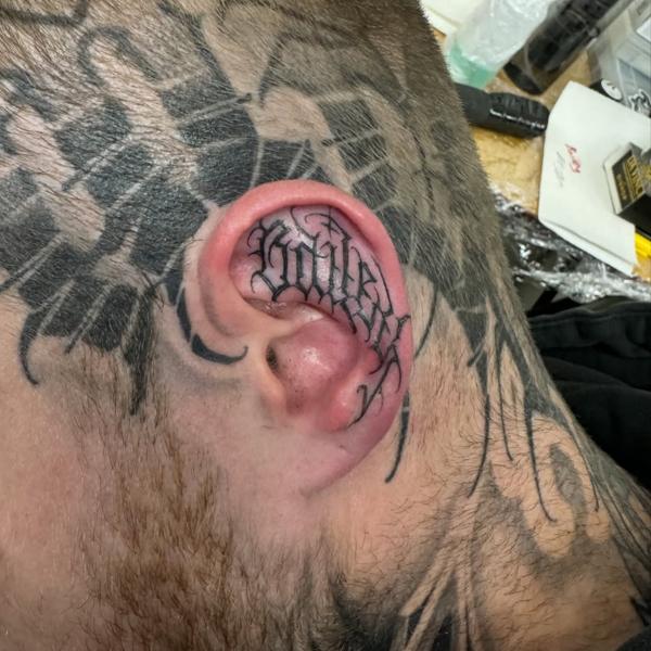 Blackwork lettering tattoo by @niorkz