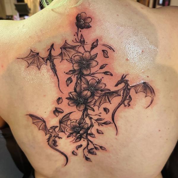 Fine line floral dragons tattoo by @j_c_tattoos