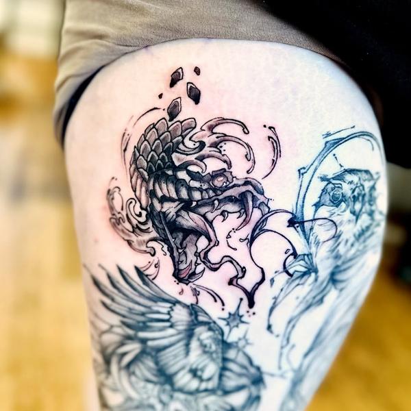 Illustrative blackwork scaled monster head tattoo by @j_c_tattoos