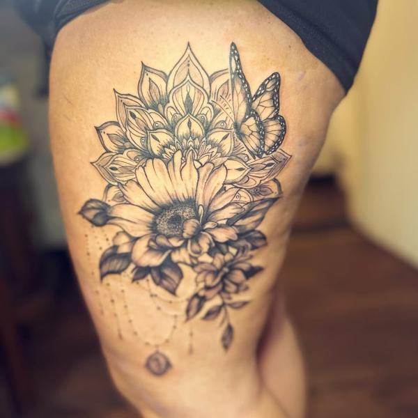 Illustrative blackwork mandala floral butterfly tattoo by @j_c_tattoos
