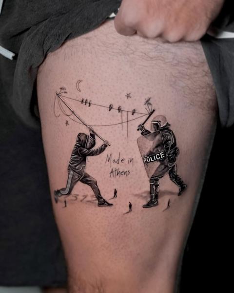 Realism protest scene tattoo by @kallia_tatts