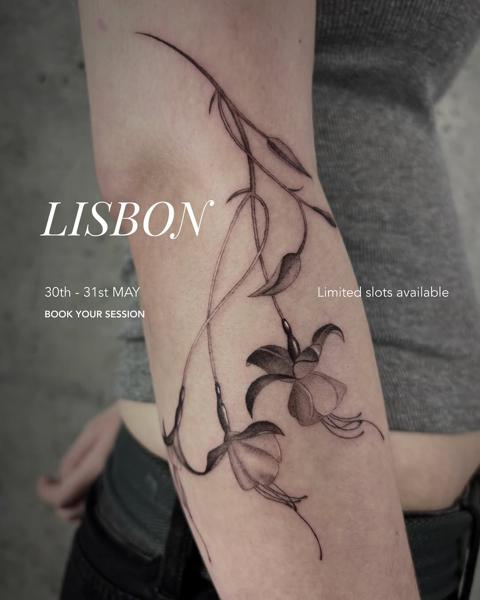 Fine line fuchsia flowers tattoo by @karolina_tattooer