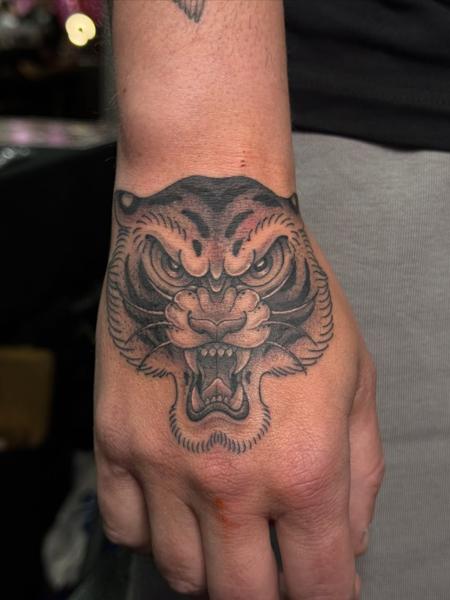 Traditional tiger head tattoo by @katcorneytattoo