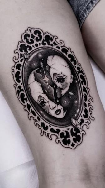 Dark illustrative shattered doll face tattoo by @achlys.ttt