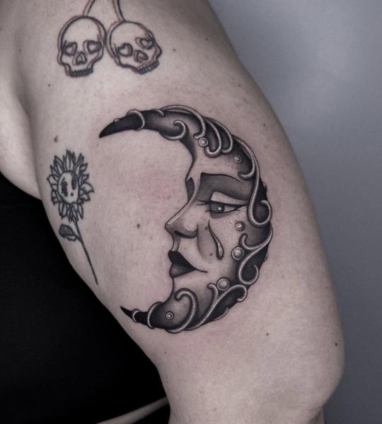 Neo-traditional crying moon face tattoo by @achlys.ttt
