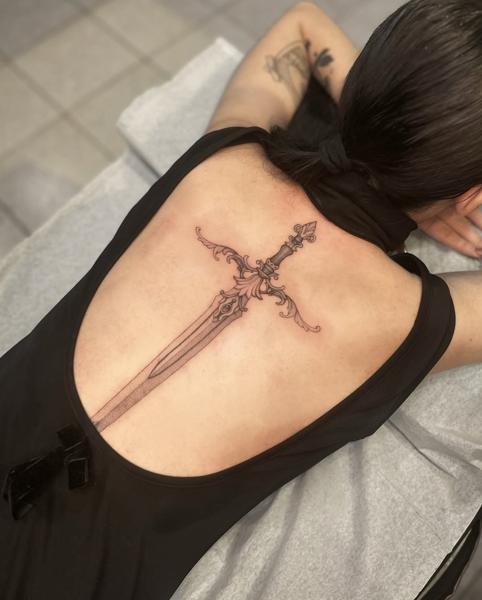 Fine line ornate sword tattoo by @katia.iink