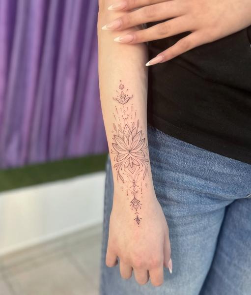 Fine line ornamental lotus tattoo by @katia.iink