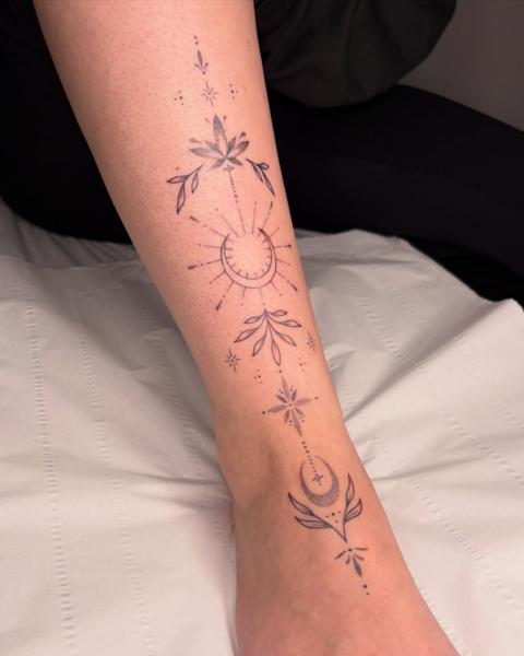 Fine line celestial design tattoo by @nevermind.tattoos