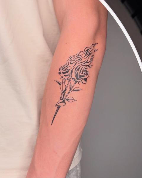 Linework flaming rose tattoo by @nevermind.tattoos