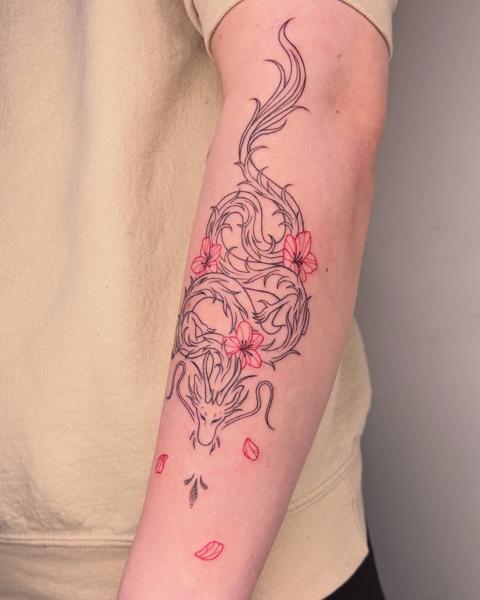 Fine line floral dragon tattoo by @nevermind.tattoos