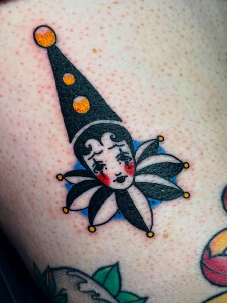 Traditional clown face tattoo by @katwhysalltattoos