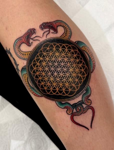 Traditional snakes flower of life tattoo by @katysars