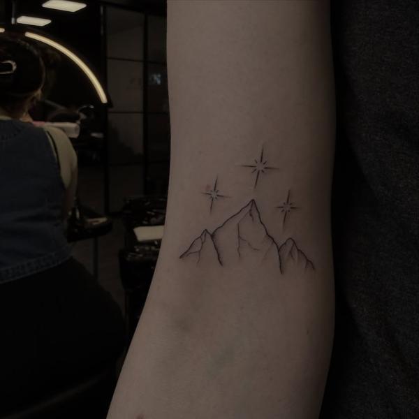 Fine line mountain stars tattoo by @kaymieseven