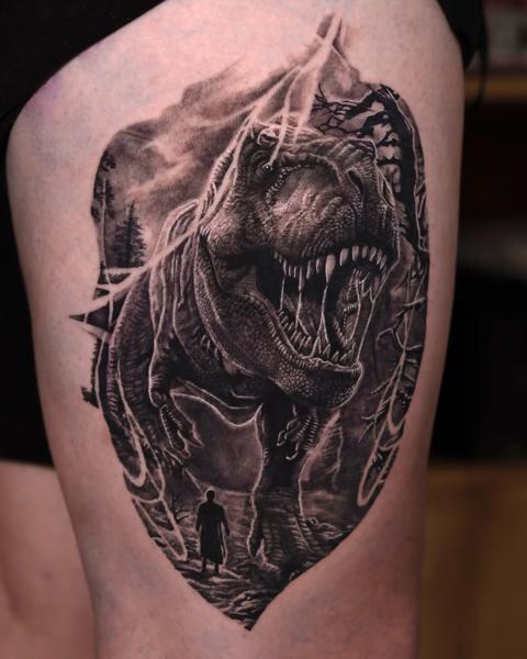 Realism dinosaur scene tattoo by @kazin_tattooer