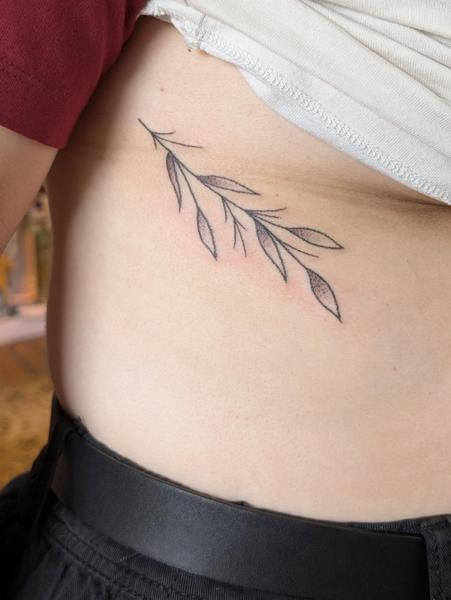 Fine line leaf branch tattoo by @kellyneedles