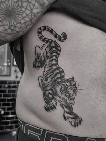 Traditional japanese crawling tiger tattoo by @kerieedwardstattoo