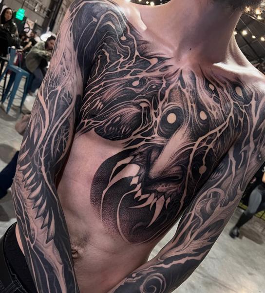 Blackwork abstract creature tattoo by @kinezos_qq