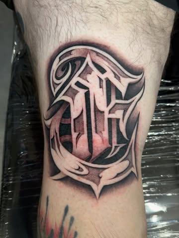 Blackwork ornamental letter tattoo by @kingsley_hayward