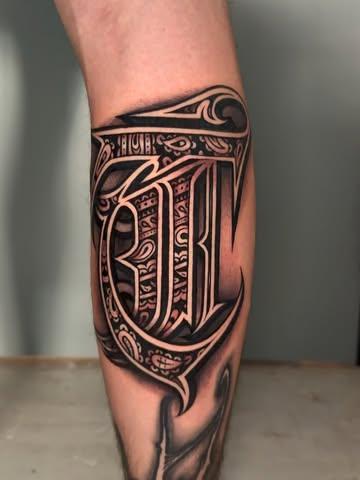 Lettering ornamental letter tattoo by @kingsley_hayward