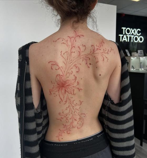 Fine line floral design tattoo by @kira_ludwig_tattoos