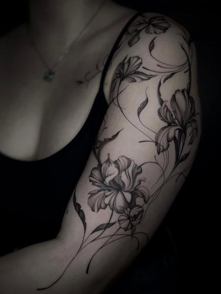 Fine line floral design tattoo by @zzirini