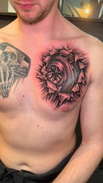 Realism tire and skull tattoo by @korneltattoo